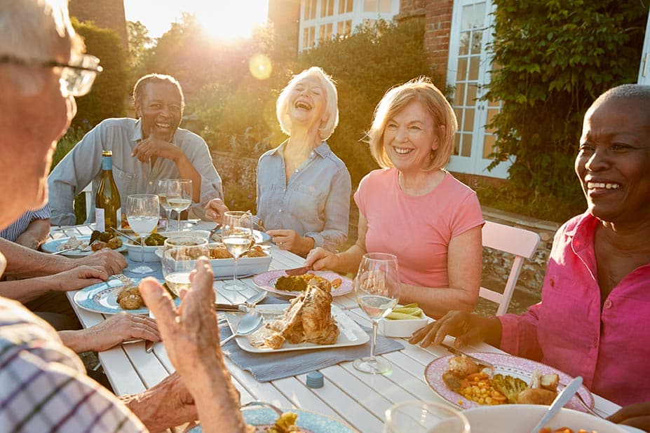 Senior Friends Enjoying Outdoor Dinner Party
